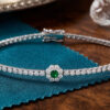Tennis Bracelet with Emerald Centered Flower Clusters