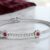 Tennis Bracelet with Ruby Centered Flower Clusters