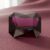 Natural emerald cut garnet gemstone on soft pink fabric