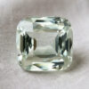 Natural cushion cut green beryl gemstone on soft ivory satin