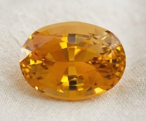 Natural honey zircon oval cut gemstone, front view