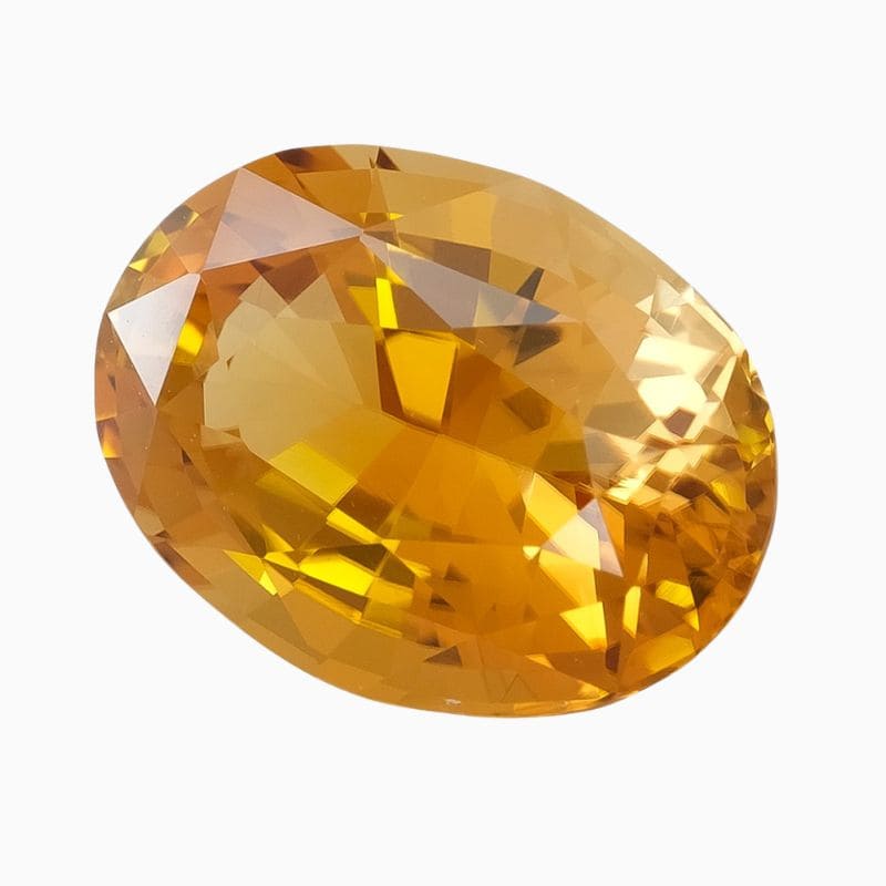 Natural honey-yellow oval zircon gemstone