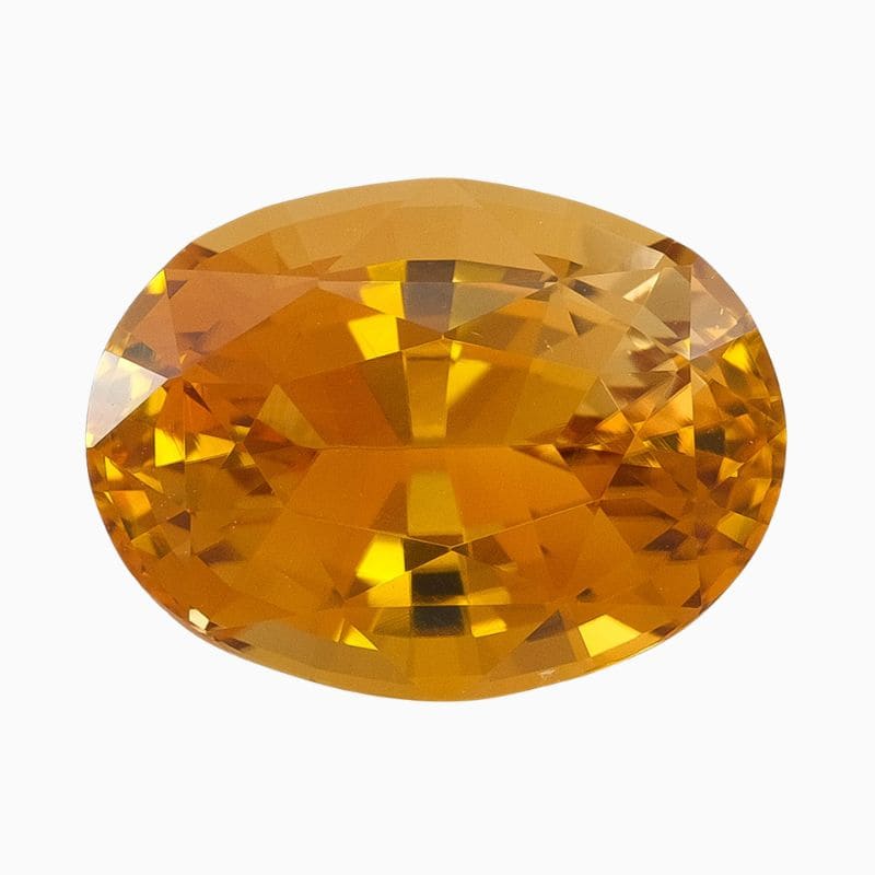 Natural honey-yellow oval zircon gemstone