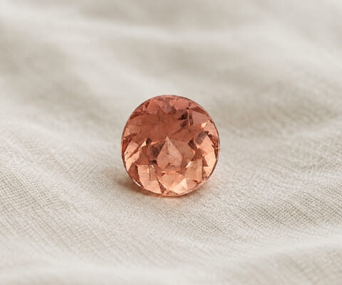 Natural imperial topaz gemstone, oval cut front view