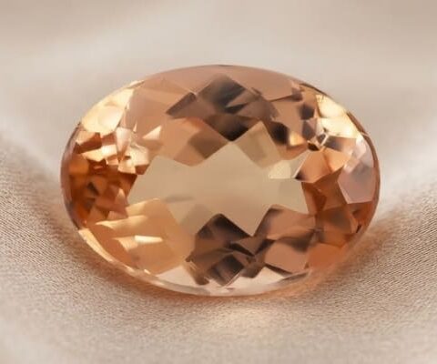 Natural imperial topaz gemstone, oval cut front view