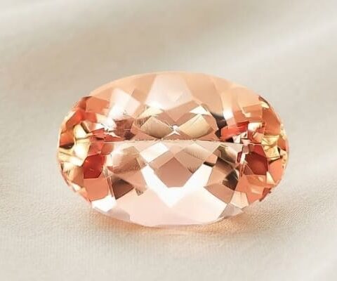 Natural imperial topaz gemstone, oval cut front view