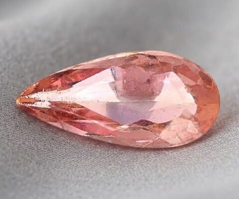 Natural imperial topaz gemstone, pear cut front view