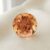Natural imperial topaz gemstone, round cut front view