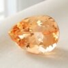 Natural imperial topaz gemstone, pear cut front view