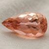 Natural imperial topaz gemstone, pear cut front view
