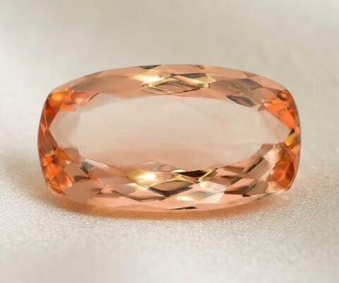 Front view of cushion-cut natural imperial topaz gemstone