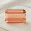 Front view of emerald-cut natural imperial topaz gemstone