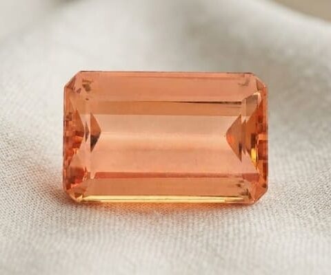 Natural peach Imperial Topaz emerald cut gemstone front view