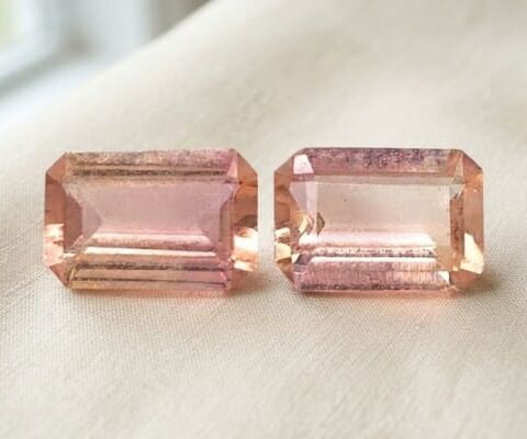 Natural light pink Imperial Topaz matching pair emerald cut gemstones front view