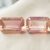 Natural light pink Imperial Topaz matching pair emerald cut gemstones front view