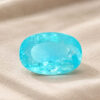 Natural Paraiba Tourmaline oval cut turquoise blue gemstone on ivory fabric