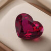 Natural Mozambique Ruby heart cut red gemstone in wooden jewellery display tray