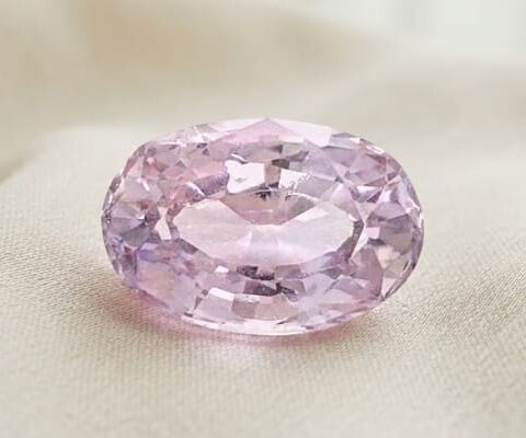 Natural oval peach sapphire gemstone top view