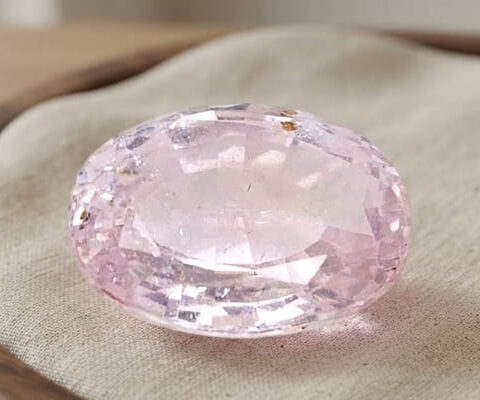 Natural oval peach sapphire gemstone top view