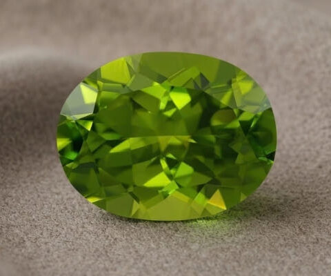 Natural oval peridot gemstone top view