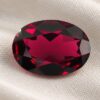 Natural Rhodolite Garnet gemstone with rich raspberry-red color and oval cut, front view.