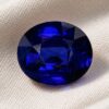 Natural Royal Blue Sapphire gemstone with rich blue color and oval cut, front view.