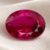 Natural Rubellite Tourmaline gemstone with vivid raspberry-pink color and oval cut, front view.