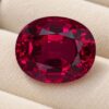Natural Rubellite Tourmaline gemstone with deep raspberry-red color and oval cut, front view.