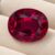 Natural Rubellite Tourmaline gemstone with deep raspberry-red color and oval cut, front view.