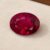 Natural Rubellite Tourmaline gemstone with rich raspberry-red color and oval cut, front view.