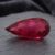 Natural Rubellite Tourmaline gemstone with rich raspberry-red color and pear cut, angled view.