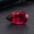 Natural Rubellite Tourmaline gemstone with deep raspberry-red color and pear cut, angled view.