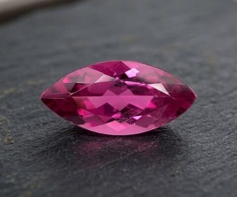 Natural Rubellite Tourmaline gemstone with vibrant raspberry-pink color and marquise cut, front view.