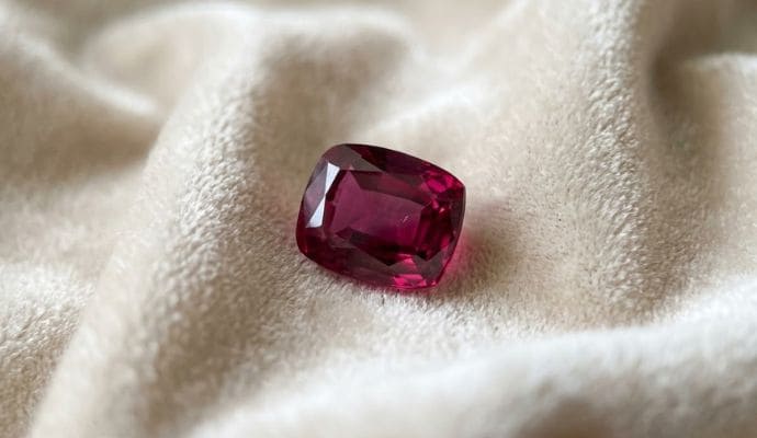 Natural Deep Pink Ruby Cushion Cut Gemstone Angled View