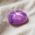 Natural Purple Pink Star Ruby Oval Cabochon Angled View