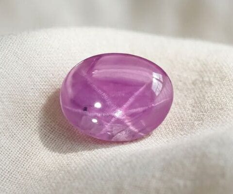 Natural Pink Star Ruby Oval Cabochon Front View